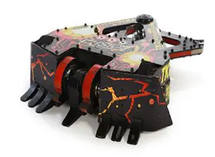 A toy robot with red and black flames on it.
