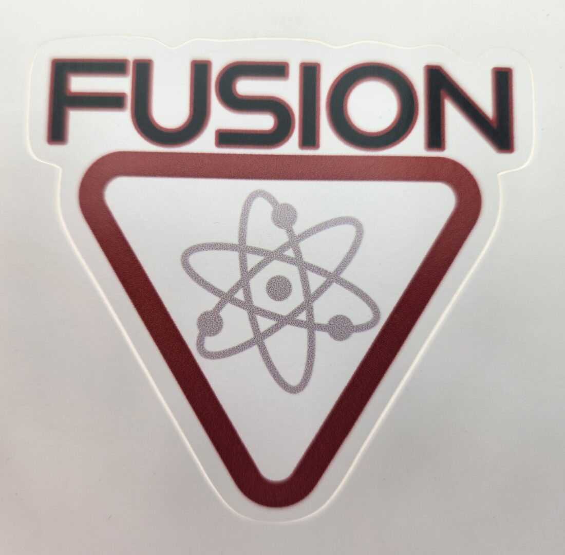 A sticker of an atom with the word fusion underneath it.
