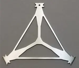 A metal triangle with three legs on top of it.