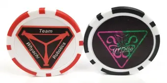 Two poker chips with a team robotics logo on them.