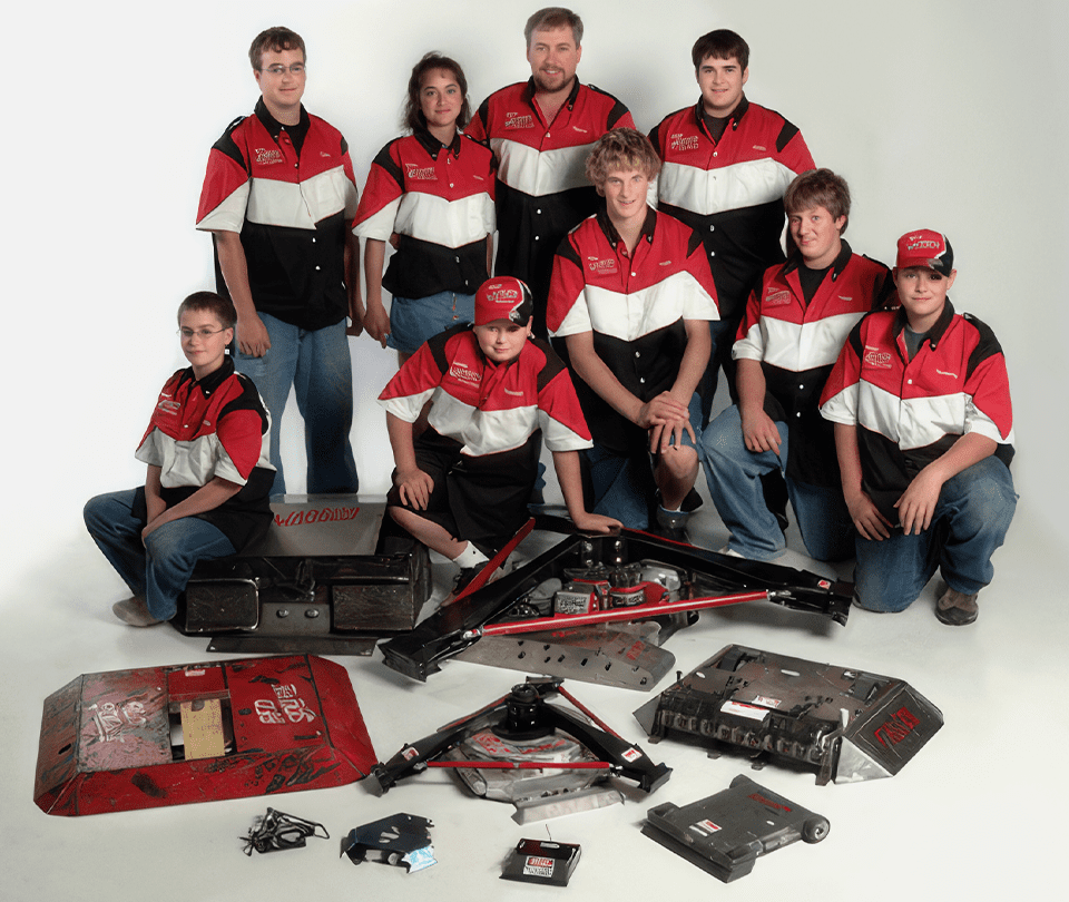 A group of people with some electronics and other items.